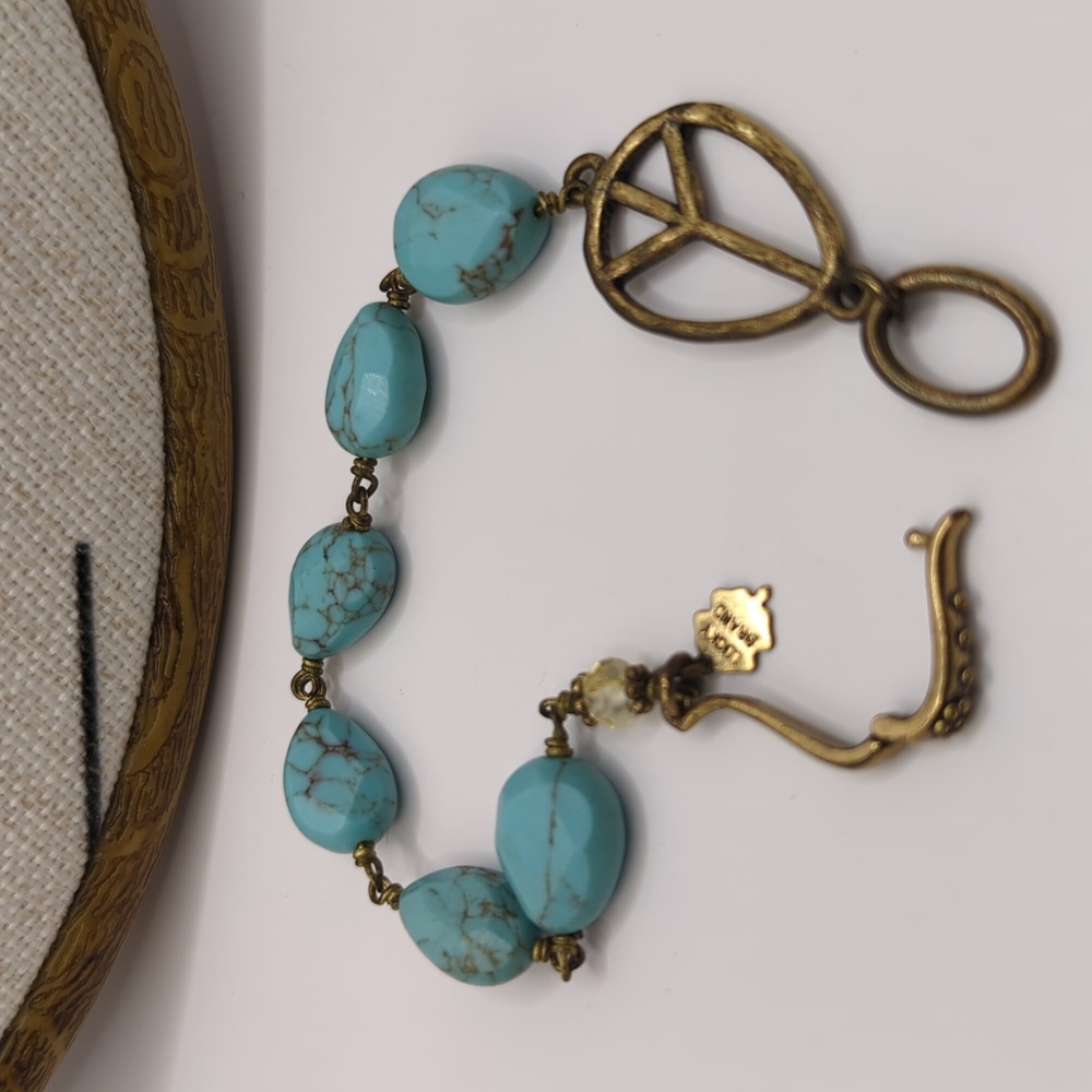 Lucky brand turquoise metal and acrylic bracelet with peace sign